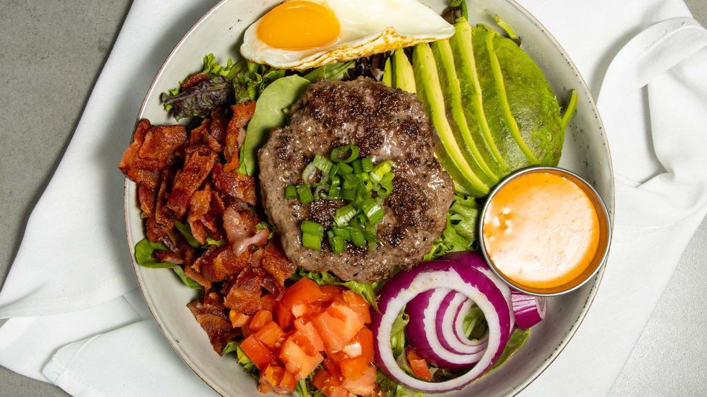 Burger Bowl · One-third burger, greens, tomato, onion, applewood bacon, and avocado topped with an over-easy egg and our special sauce.