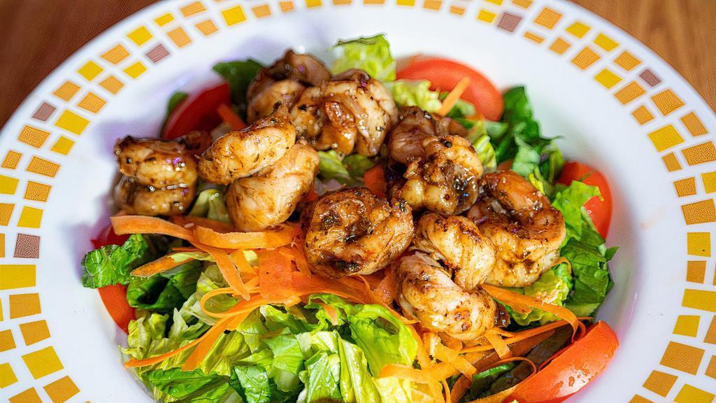 Shrimp Salad · Crisp greens topped with  shrimp and a combination of fresh vegetables.