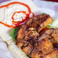 Tilapia Sandwiches · Try it jerked, grill or fried, served on our soft coco bread with mayonnaise, lettuce and on...