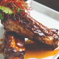 Sticky Ribs · twice cooked pork ribs with hoisin chili sauce.