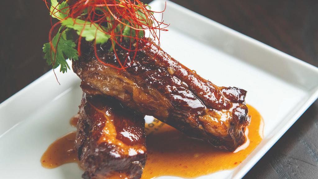 Sticky Ribs · twice cooked pork ribs with hoisin chili sauce.