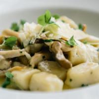 Hand-Rolled Potato Gnocchi · Served with organic mushrooms, basil, white truffle oil.