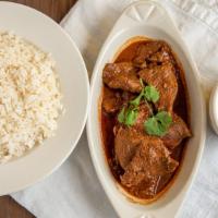 Stew Beef/Res Guisada · Served with rice and red beans