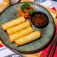 Veggies Spring Rolls · Sliced cabbage, carrots and glass noodles, wrapped in a rice sheet and deep-fried until gold...
