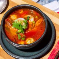 Tom Yum Soup · Spicy. Choice of your meat. Thai famous hot and sour soup boiled with lemongrass, kaffir lim...