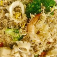 Seafood Fried Rice · Stir-fried rice with shrimp. Squid and scallop, egg, onion, broccoli and carrot in a house s...