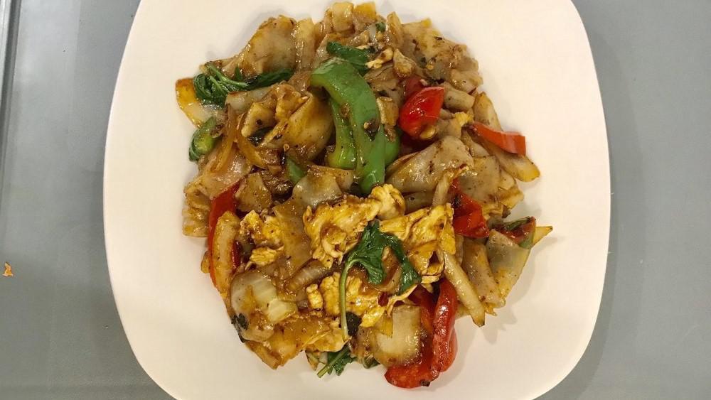 Drunken Noodle · Stir-fried large flat rice noodles, with choice of your meat, red and green peppers, and onion in spicy roasted chili and hot basil sauce.