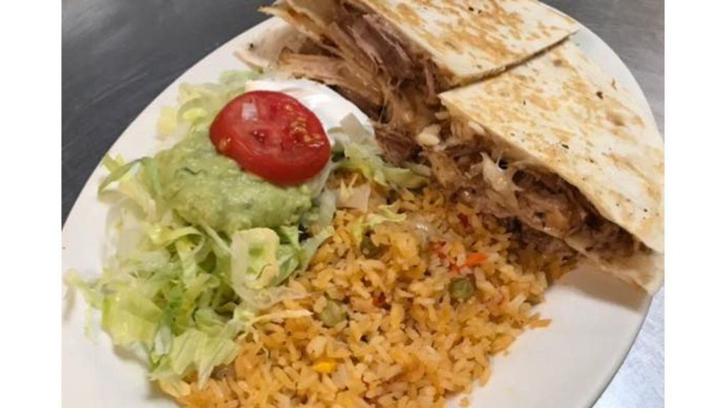 Quesadilla Carnitas · Two grilled flour tortillas grilled with shredded pork, Mexican Salad, and rice on the side.