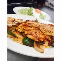 Fiesta Alambre Shish-Kebabs · Marinated chicken breast, shrimps, tomatoes, bell peppers, onions, and mushrooms. Our secret...