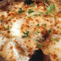 French Onion · Flavorful broth loaded with caramelized onions topped with homemade croutons and melted chee...