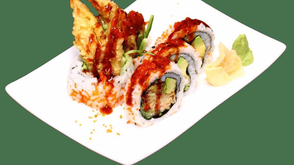 Spider Roll · Soft shell crab tempura, cucumber and avocado on the inside, topped with tobiko and eel sauce.