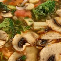 Tom Yum Noodle Soup ** · Thai style hot and sour soup with a choice of chicken, shrimp or tofu combined with mushroom...