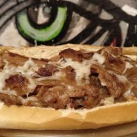 Vegan Philly Cheesesteak · Locally made vegan steak and smoked gouda cheese with fried onions on a freshly baked long r...