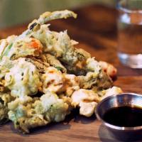 Crispy Vegetables · Tempura-battered cauliflower, cherry tomatoes, broccolini, and scallions served with our hom...