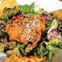 Chinese Fried Chicken Salad · Mixed lettuce with napa cabbage, wontons, peanut noodles, and mint all topped with our signa...