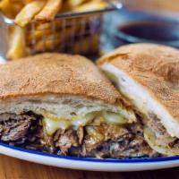 Prime Rib Dip · Slow-roasted and thinly-sliced prime rib topped with caramelized onions, gruyère cheese, and...