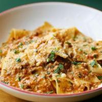 Pappardelle Bolognese · House-made pappardelle pasta with a pork & beef bolognese sauce. Topped with freshly grated ...