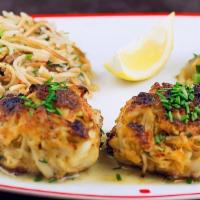 Crab Cakes · Crab mixed with bread crumbs, Old Bay, and fresh herbs. Served with fries and coleslaw.