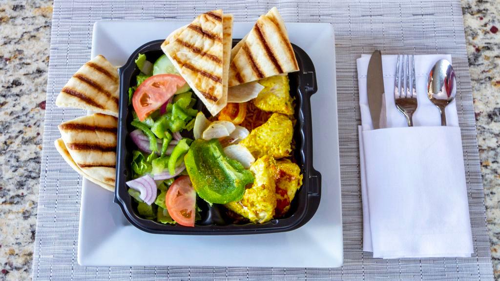 Chicken Kabob Plate · Comes with rice, salad, grilled vetoes and pita.