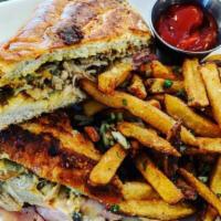 Cubano Panini With Fries  · Housemade roasted pork, black forest ham, mustard mayonnaise, gruyere, sliced pickles.