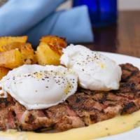 Steak & Eggs  · Eight ounce strip steak, potato confit, two poached eggs, mustard hollandaise, fines herbs.