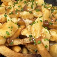 Tavern Poutine · crispy skin-on fries | rich beef gravy | cheese curds | chives