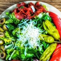 Chef Salad · Lettuce, tomatoes with sliced ham, pepperoni, green olives, and pepperoncini. Topped with Pa...