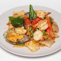 Drunken Noodle · Spicy stir-fried flat noodles with scrambled egg, onion, bell pepper, basil, and bamboo shoo...
