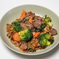 Pad See Ew · Stir-fried wide rice noodles and Chinese broccoli with black soy sauce and your choices of m...