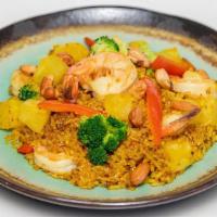 Pineapple Fried Rice · Fried jasmine rice with vegetable, eggs, and pineapple seasoned with curry topped with cashe...