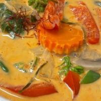 Red Curry With Rice · Thai red coconut based curry with bamboo shoots, Thai eggplants, bell peppers and sweet basi...