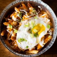Kimchi Fries · Crispy potato fries loaded with kimchi-lime, melted cheese blend, freshly cracked egg, cilan...