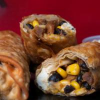 Tex-Mex Eggroll · 2 soft and crispy shelled eggrolls stuffed with chicken, corn, black bean, roasted red peppe...