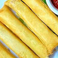 Thai Mozzarella Sticks · Mozzarella cheese, wrapped in a rice wrapper and deep-fried--yummy!