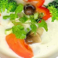 Tom Kha Soup · (Coconut soup) Thai style coconut soup seasoned with vegetable, carrots, galanga, tomatoes, ...