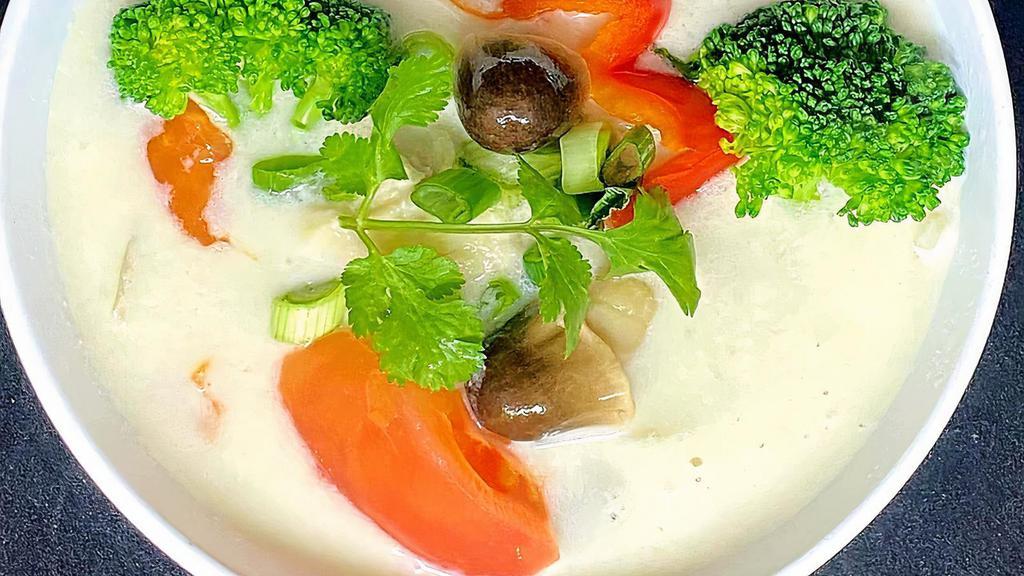 Tom Kha Soup · (Coconut soup) Thai style coconut soup seasoned with vegetable, carrots, galanga, tomatoes, lemon juice, lemongrass and kaffir lime leaves.