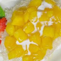 Mango, Sweet Sticky Rice, Coconut Milk · A traditional Thai dessert. Chunks of mango over sticky rice covered with warm coconut milk.