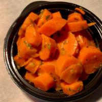 Tarragon Carrot Coins · Our Tarragon Carrot Coins are prepared with Lemon, Butter, Olive Oil & Tarragon 

- gluten f...