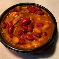 Boston Baked Beans · Our Boston Baked Beans are made with canellini beans, onions, celery, molasses, salt pork, s...