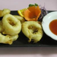 Golden Ring · Fried calamari with tempura seasoned until brown with sweet sour chili sauce.
