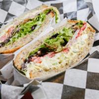 Smoked Egg Salad Sandwich  · served with field greens, tomatoes, and red onions.