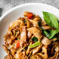 Drunken Noodles · Medium spicy. Pad Kee Mao. With wide rice noodles, chili, garlic, basil leaves, onion, Red p...
