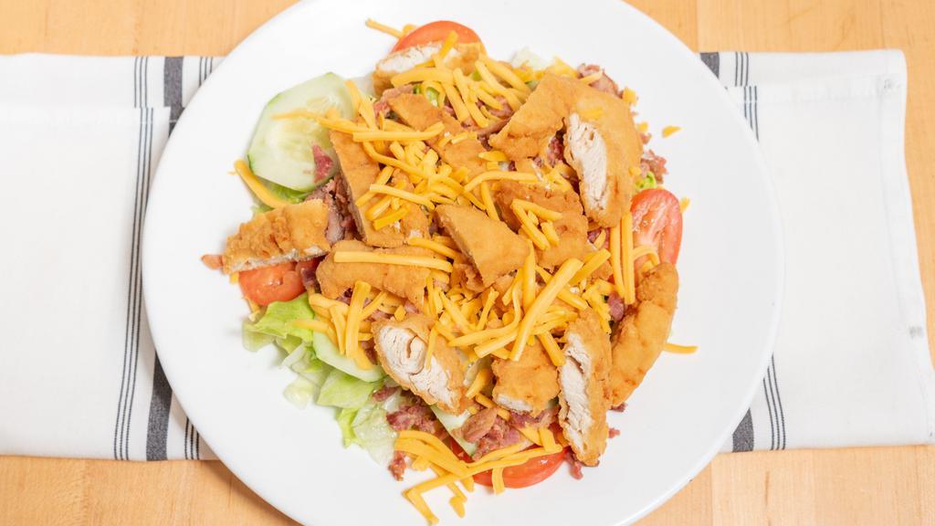 Crispy Chicken Salad · Lettuce, tomato, cucumbers, bacon, and shredded cheese.