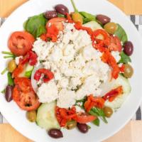 Mediterranean Salad · Baby spinach, roasted pepper, tomatoes, onions, pitted kalamata olives, and feta cheese.