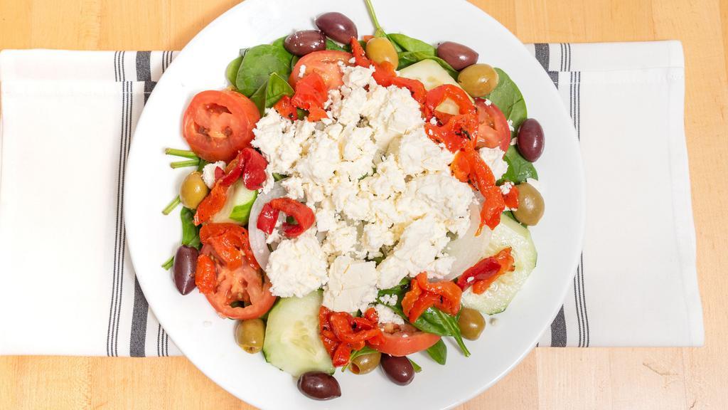 Mediterranean Salad · Baby spinach, roasted pepper, tomatoes, onions, pitted kalamata olives, and feta cheese.