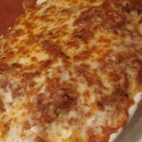 Lasagna · Served with butter, roll and choice of side.