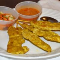A-2. Chicken Satay (4) · Grilled tender chunks of skewered chicken. Served with peanut and cucumber sauce.