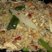 N-7. Thai Fried Rice · Stir-Fried jasmine rice with egg, onion, carrot, peas, and scallion in Thai style.