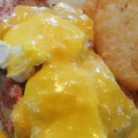 Eggs Irish · 3 Poached Eggs on Housemade Corned Beef Hash on top of an English Muffin then topped with Ho...