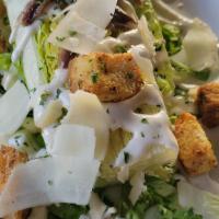 Ceasar Salad · Romain, shaved parm, anchovies with caesar dressing.